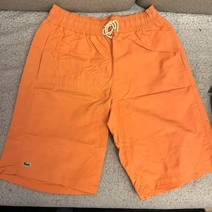 Lacoste swim trunks men size 3 (small) orange